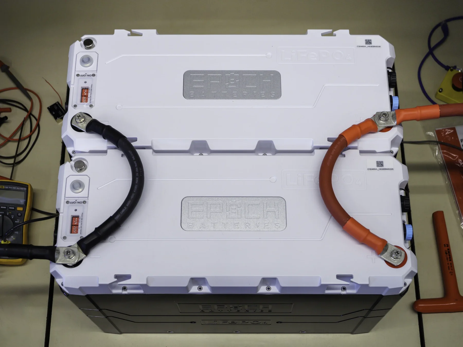 Photo of two Epoch 460Ah 12V batteries connected in parallel with 4/0 AWG cables