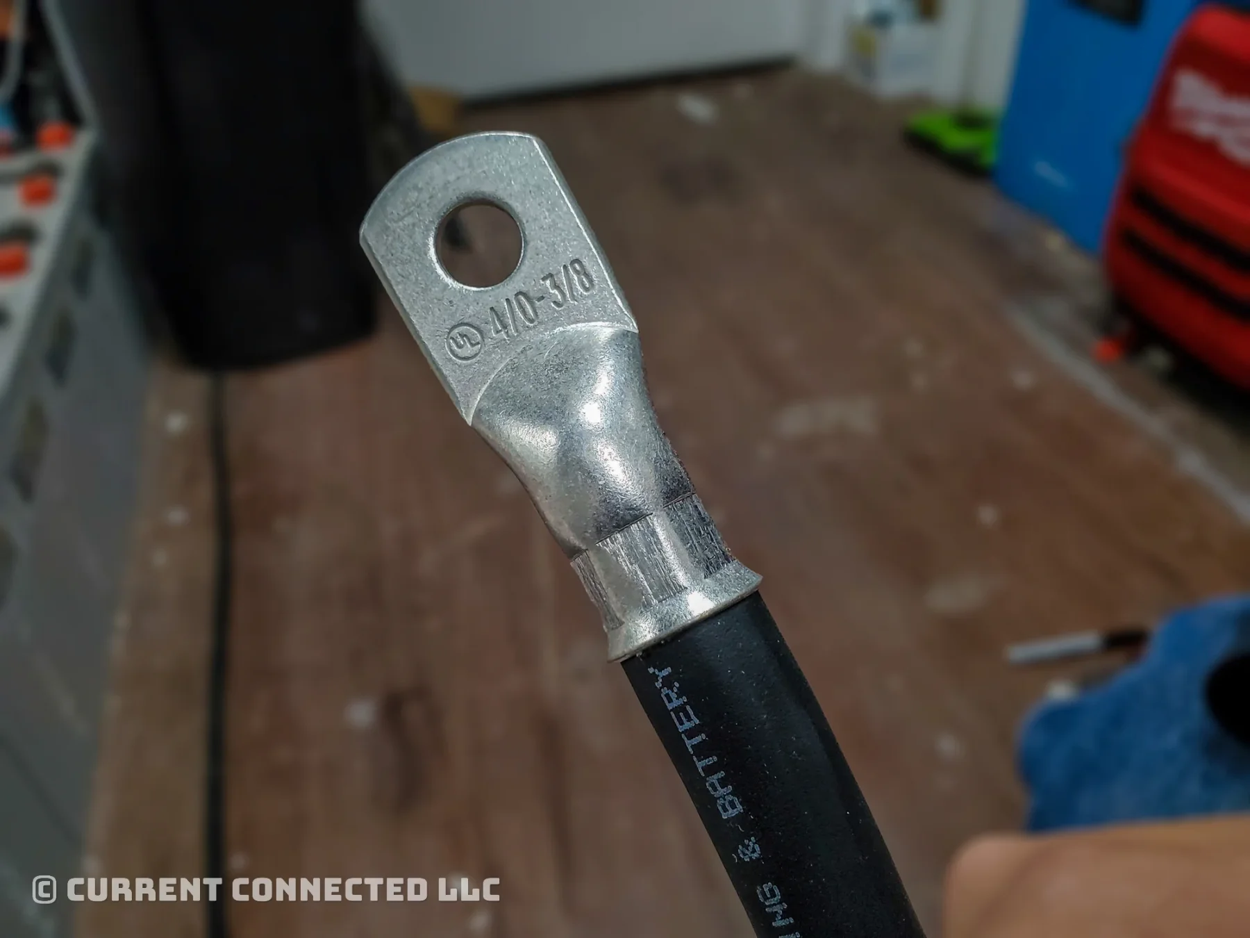 Photo of crimped lug on a battery cable.