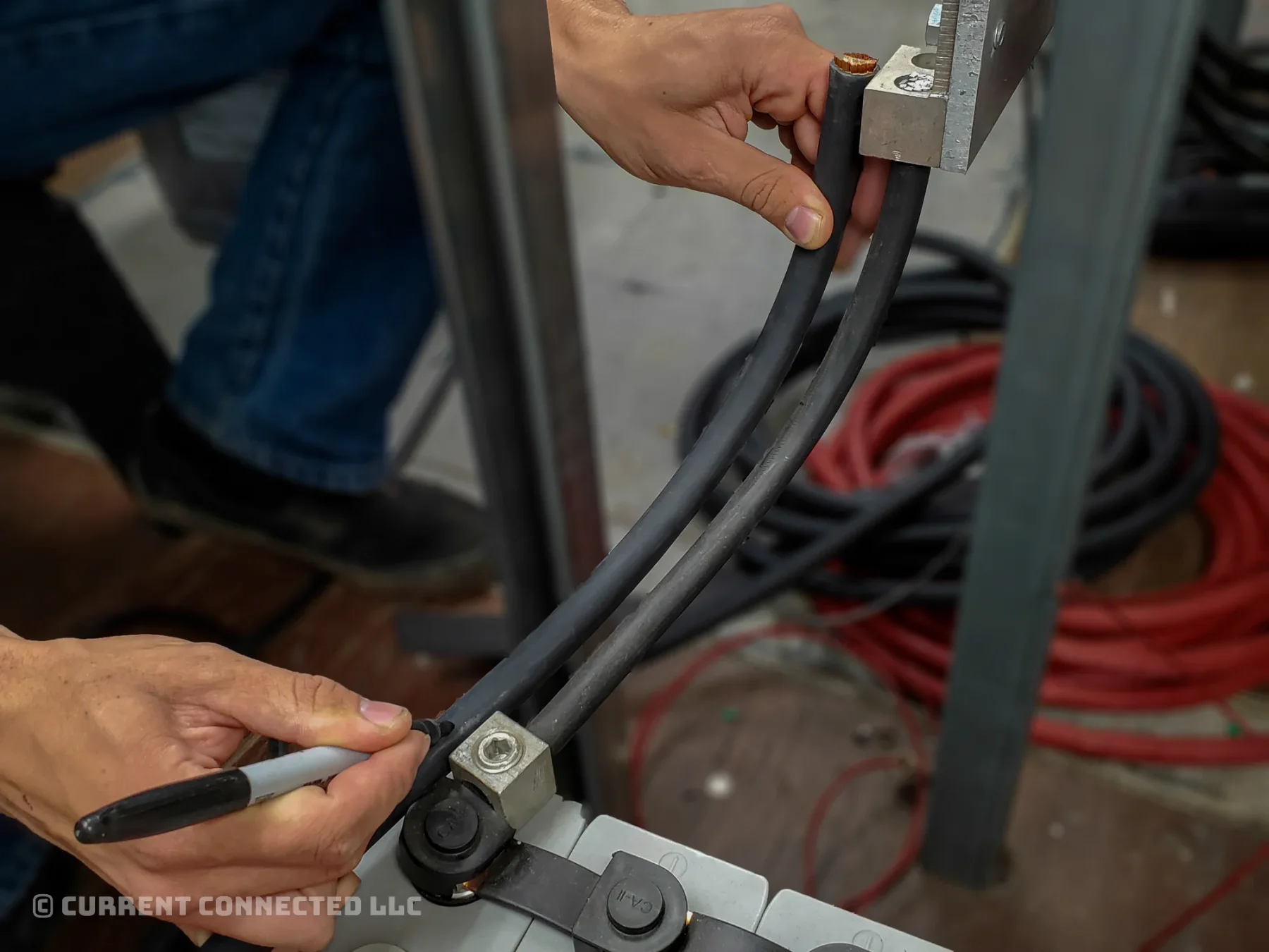 Photo of someone measuring the cable length. 