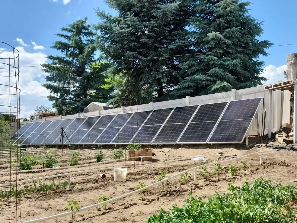 IntegraRack IR-30 solar panel mounting frames holding solar panels in a garden