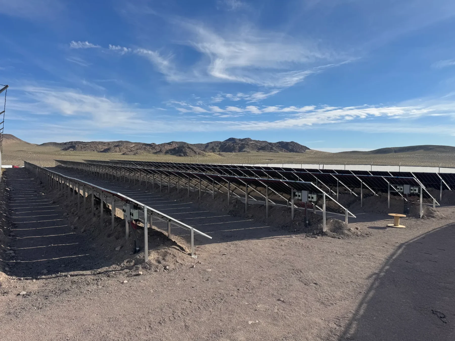 IntegraRack IR-40FSAA solar panel racking used for multiple arrays of solar panels. This view shows the rear of the arrays, with different angles on each array.